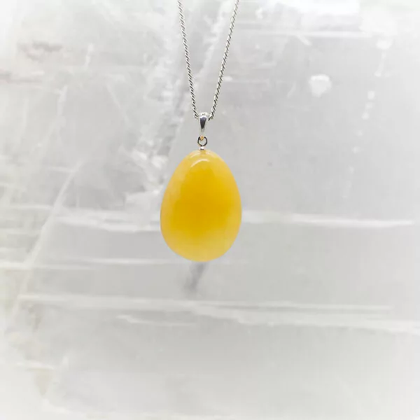 orange calcite tumbled tone pendant