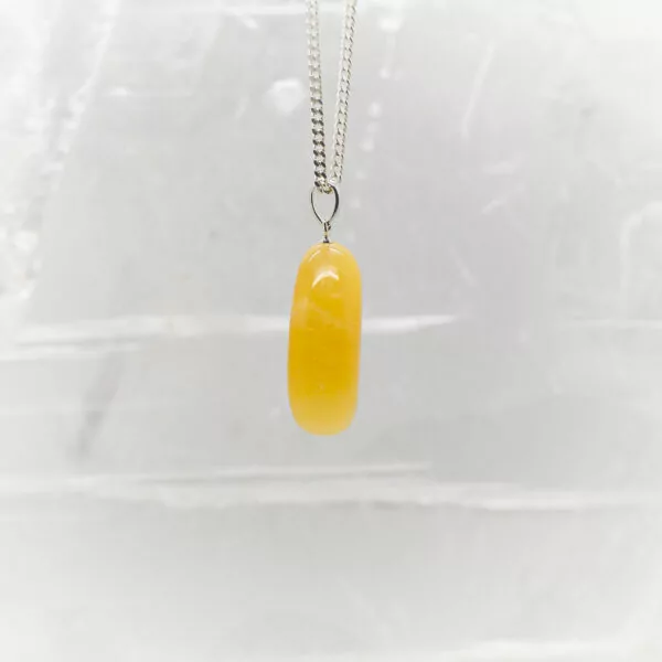 orange calcite tumbled tone pendant